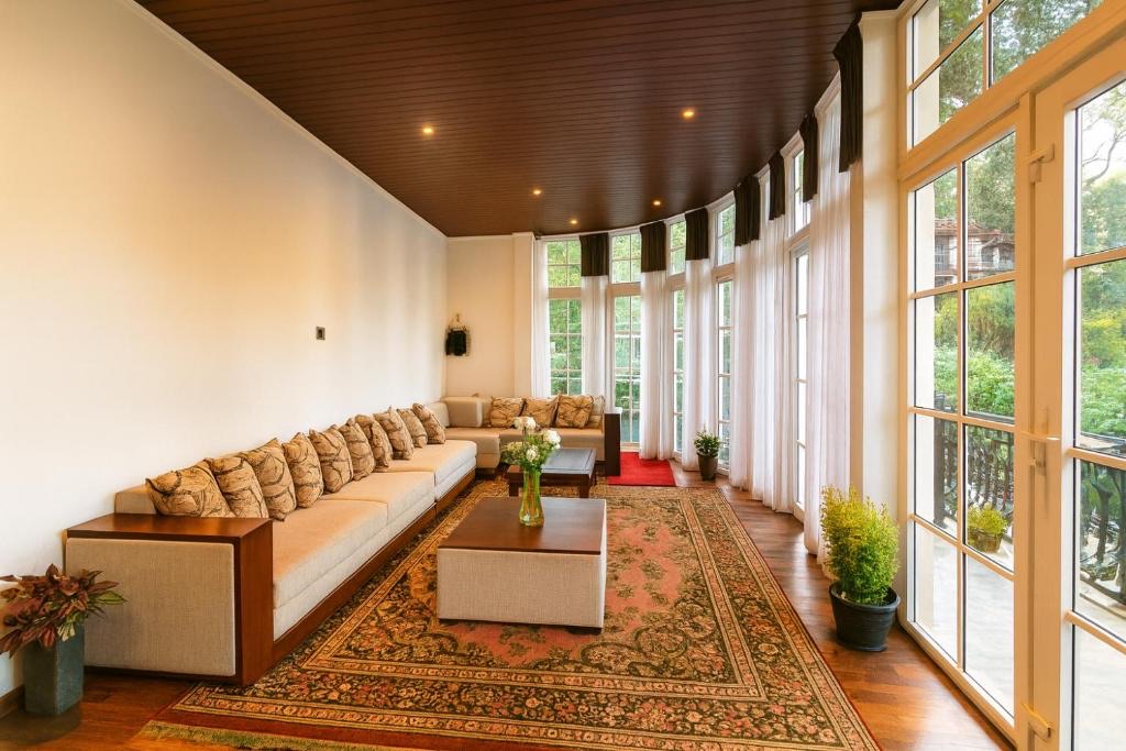 The lodge sun lounge with a long sofa beside bright windows